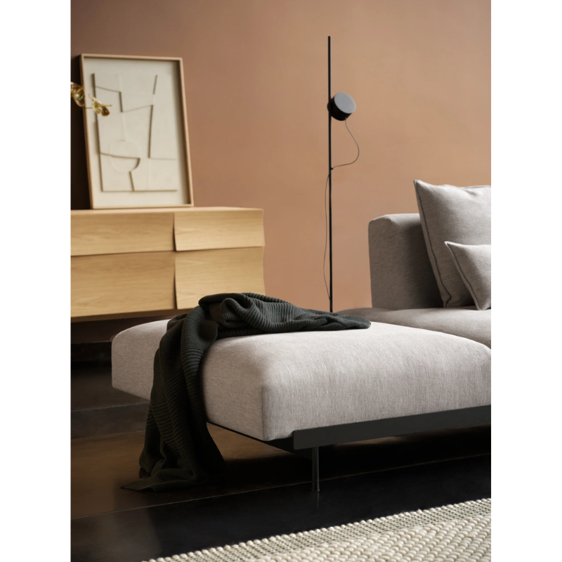 The Post Floor Lamp from Muuto in a primary bedroom.