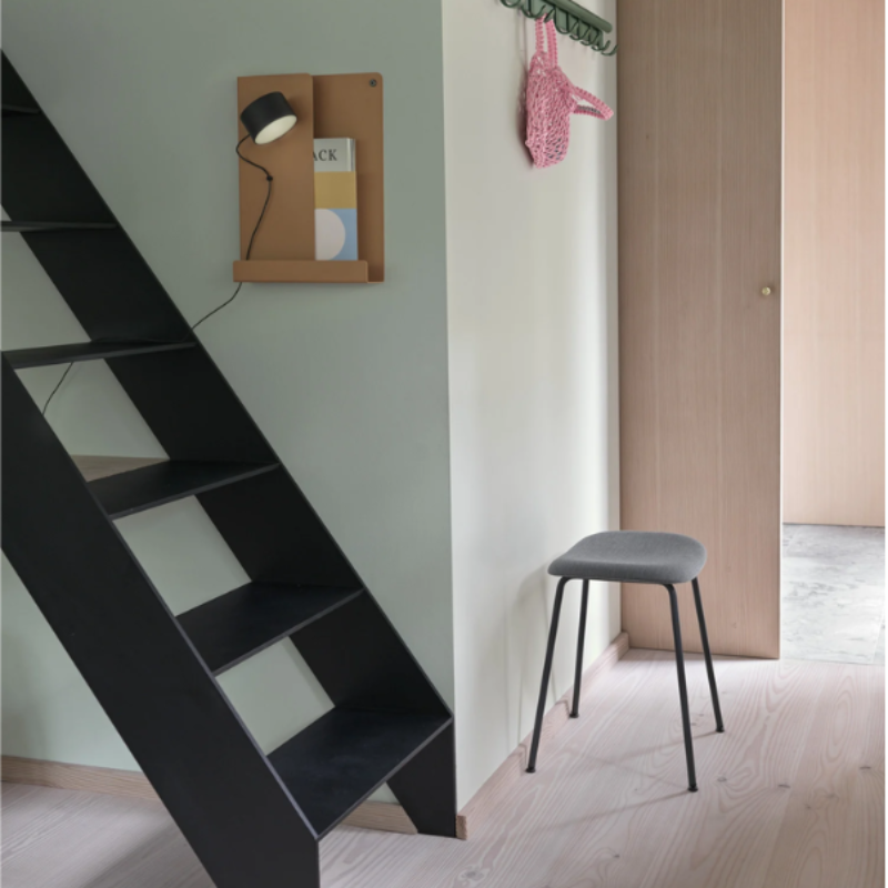 The Post Wall Lamp from Muuto in a living space.