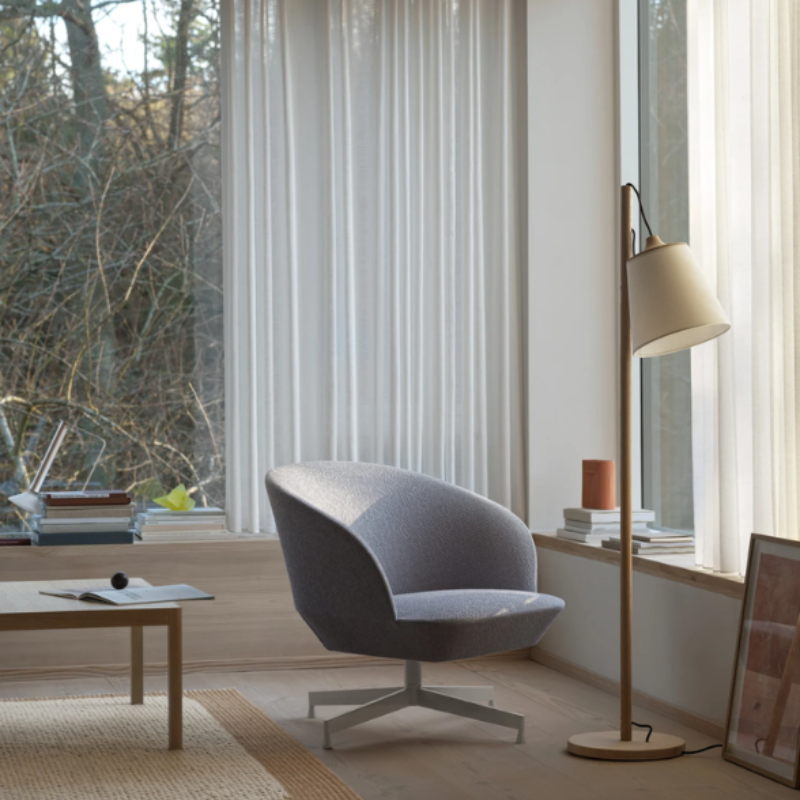The oak and white Pull Floor Lamp from Muuto in a living room.