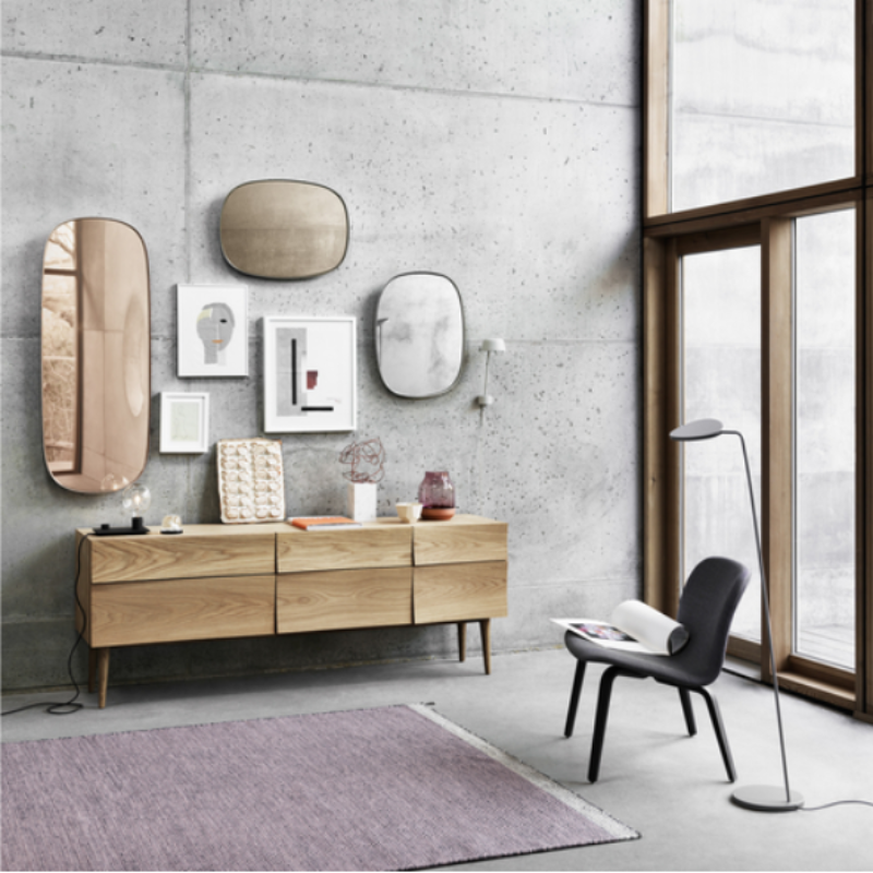 The oiled oak Reflect Sideboard from Muuto in a family space.