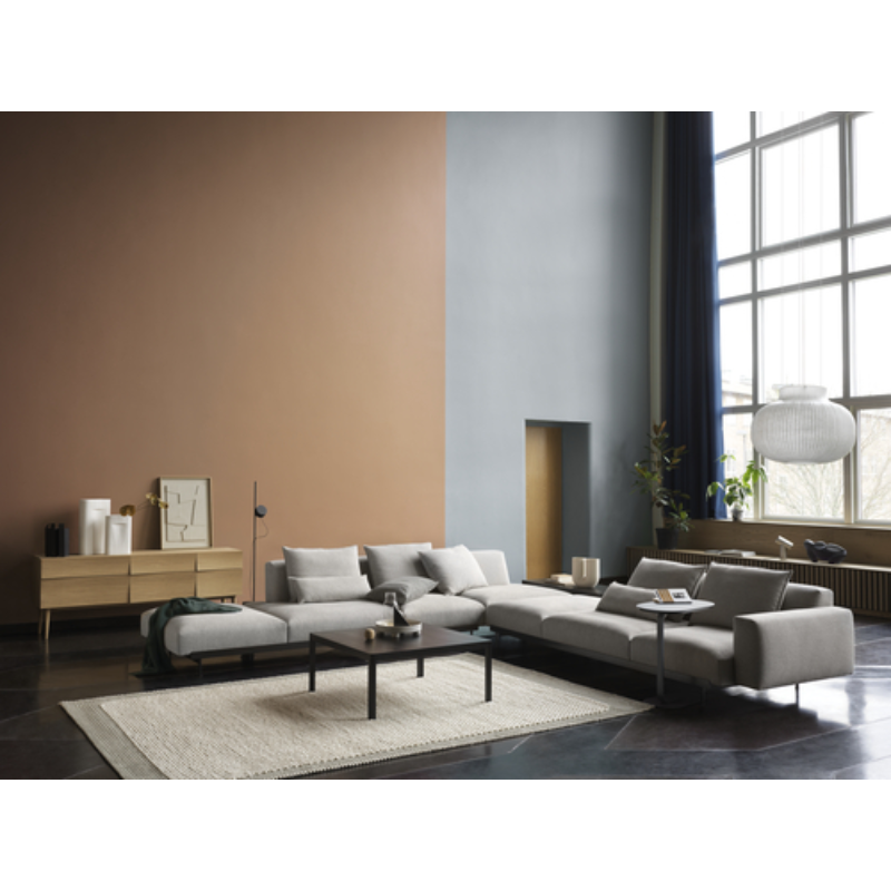 The oiled oak Reflect Sideboard from Muuto in a lounge.