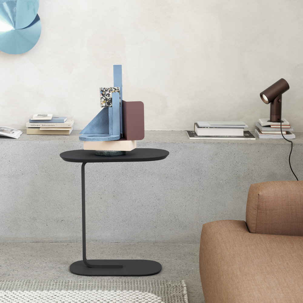 The black Relate Side Table from Muuto in a study.