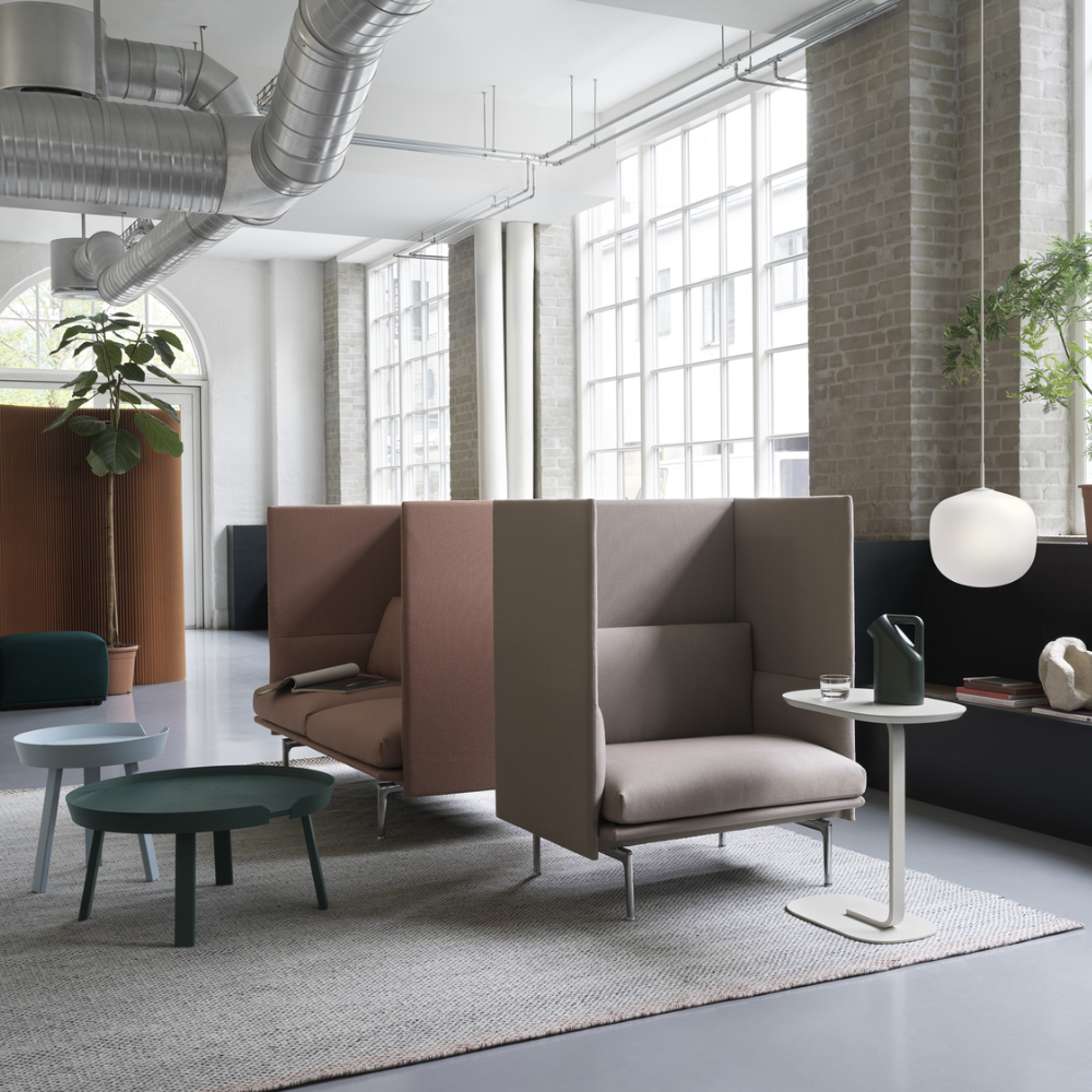 The off-white Relate Side Table from Muuto in a lounge space.