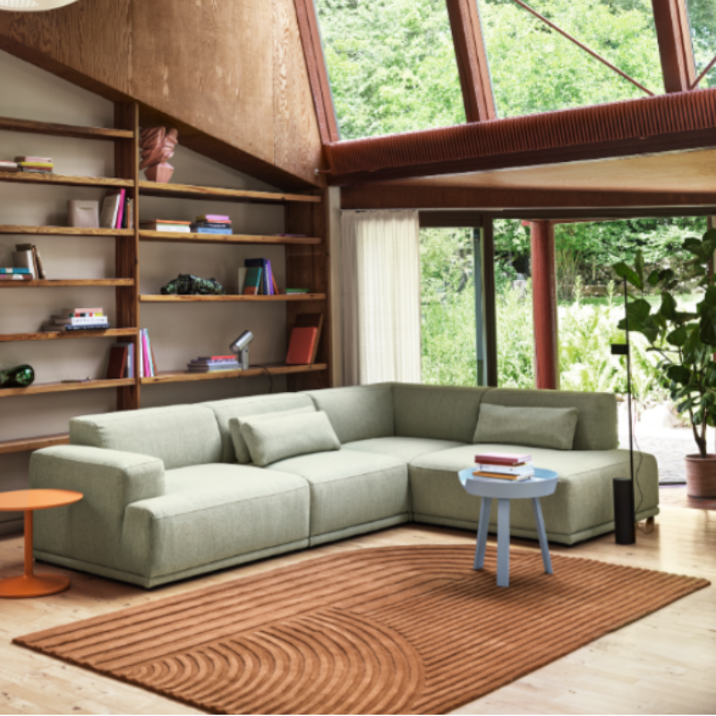 The Relevo Rug from Muuto in burnt orange in a living room.