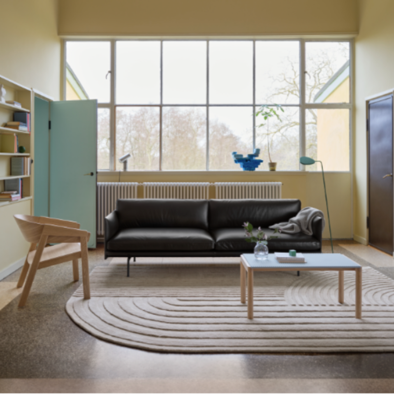 The Relevo Rug from Muuto in off white in a lounge.