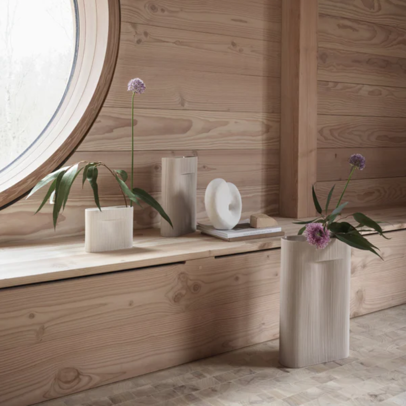 The Ridge Vase from Muuto in beige in a living space.
