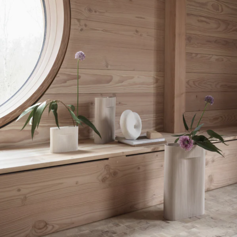 The Ridge Vase from Muuto in off white in a living room.