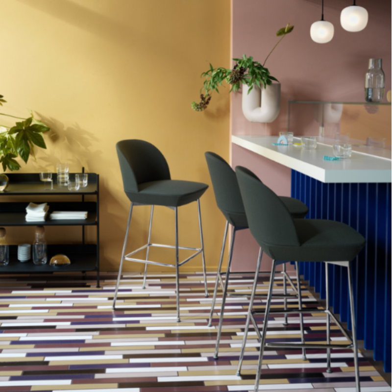 Two black Rime Pendant Lamps from Muuto above a kitchen breakfast bar.