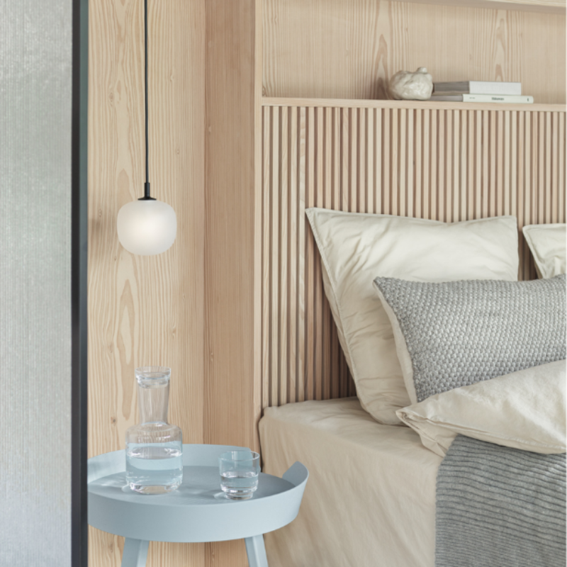 The Rime Pendant Lamp from Muuto in a primary bedroom.