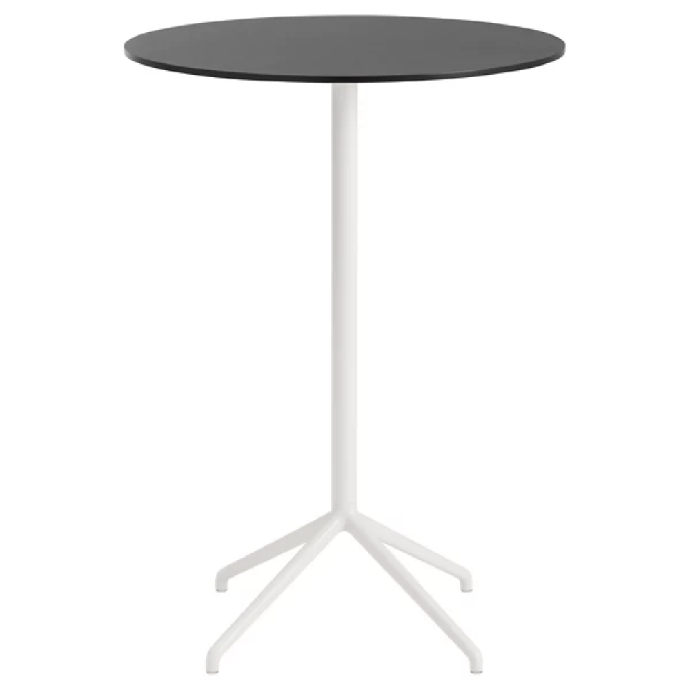 The 41 inch Still Round Cafe Table from Muuto with the black nanolaminate table top and white frame.