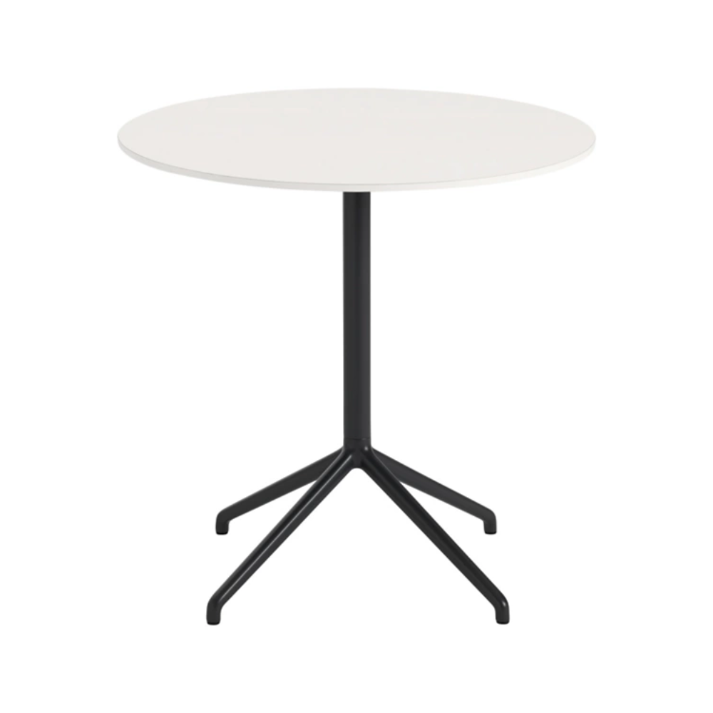 The 29 inch Still Round Cafe Table from Muuto with the white nanolaminate table top and black frame.