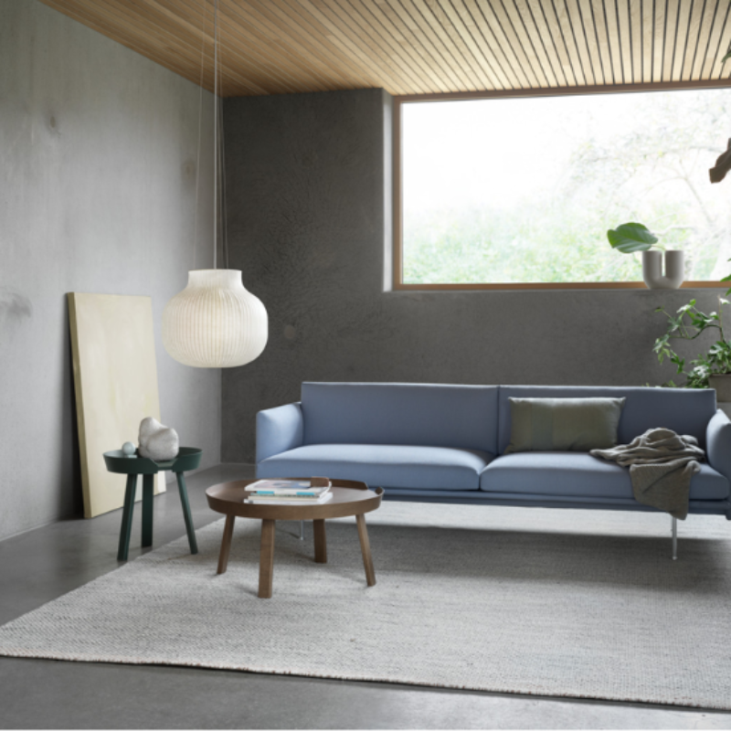 The closed Strand Pendant Lamp from Muuto, 23.5 inch size in a living room.