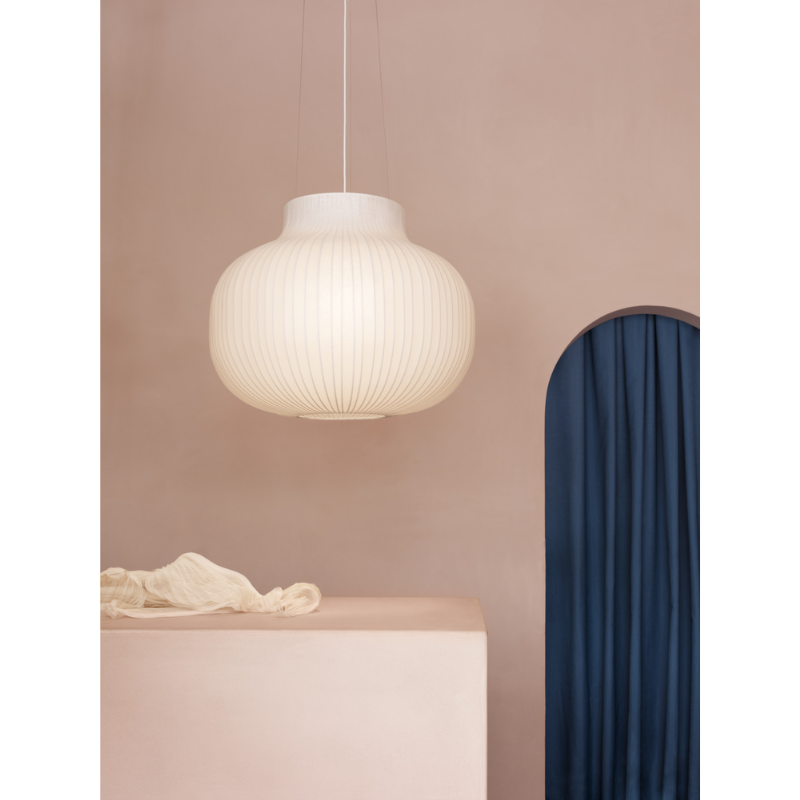The closed Strand Pendant Lamp from Muuto, 23.5 inch size in a primary bedroom.
