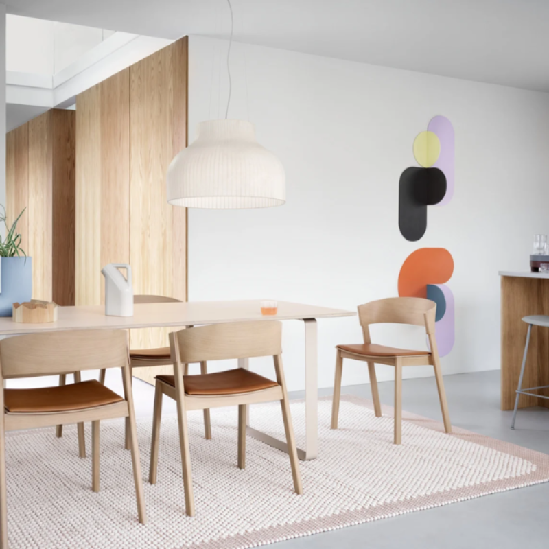 The open Strand Pendant Lamp from Muuto, 23.5 inch size in a kitchen and dining area.