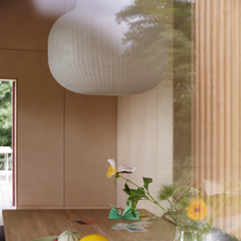 The closed Strand Pendant Lamp from Muuto, 31.5 inch size in a living space.