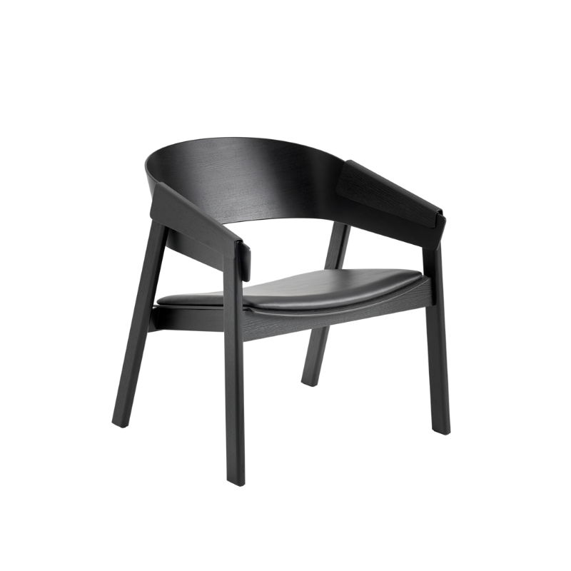 The Upholstered Cover Lounge Chair from Muuto with black refine leather in black.