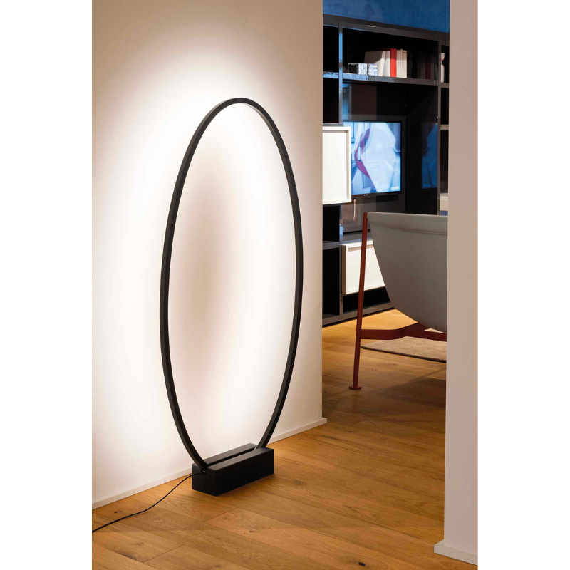 The Ellisse Floor Lamp by Nemo in a living room.