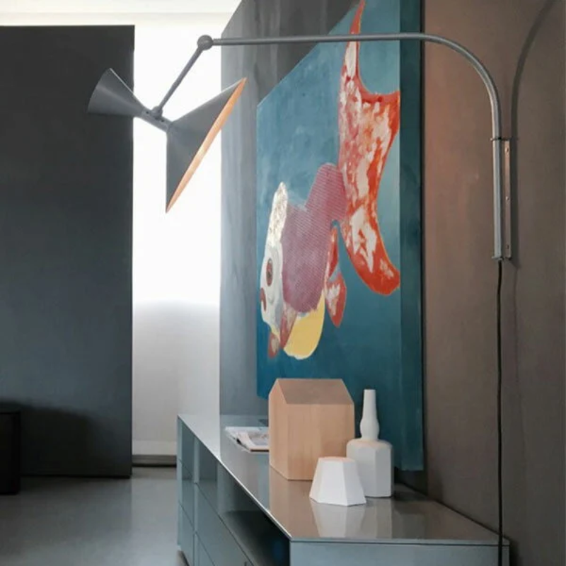 The Lampe de Marseille Mini Wall Sconce from Nemo in whitewash in a living room.