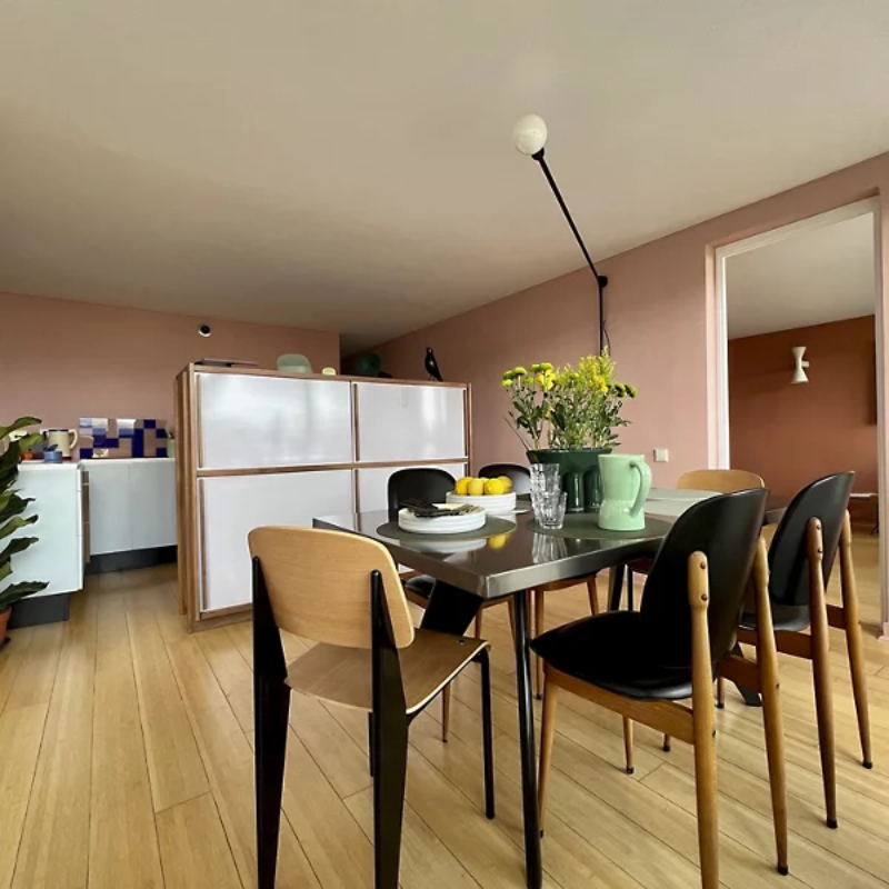 The Potence Pivotante Wall Sconce from Nemo in a kitchen and dining setting.