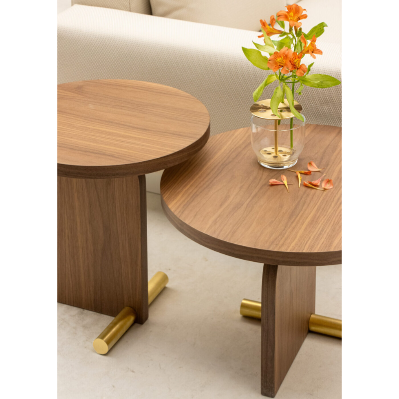 The small and large walnut and brass Nova Side Table from Nomon in a lounge.
