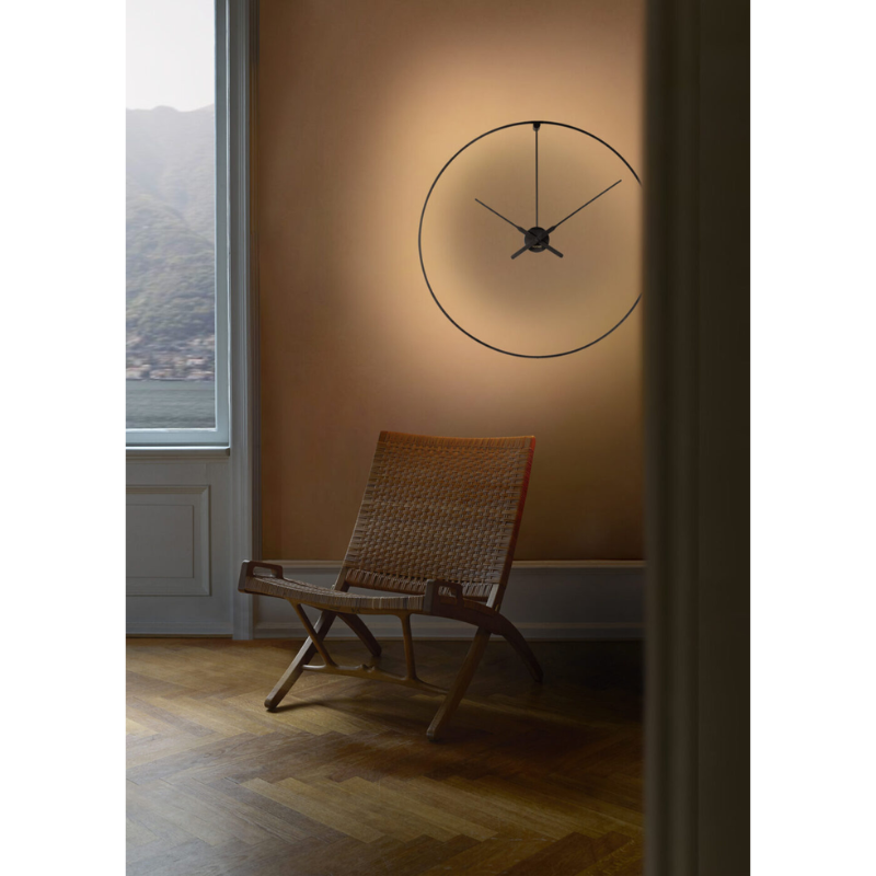 The Ombra Clock from Nomon in a living room.