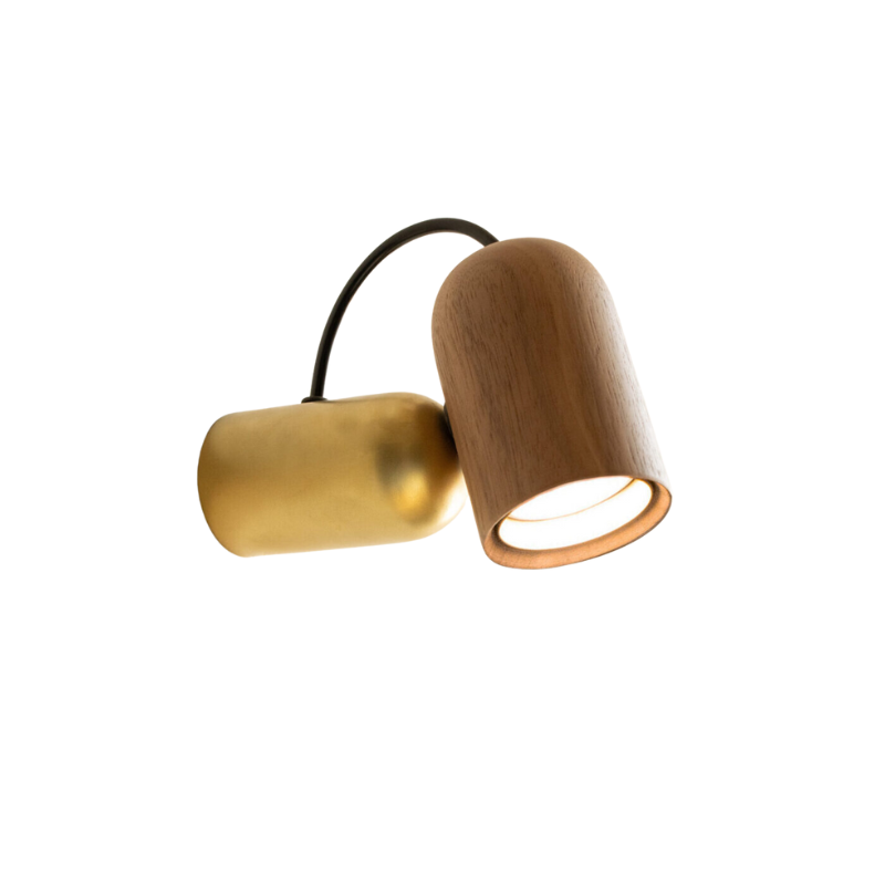 The Onfa Wall Lamp from Nomon in the walnut with brass finish.