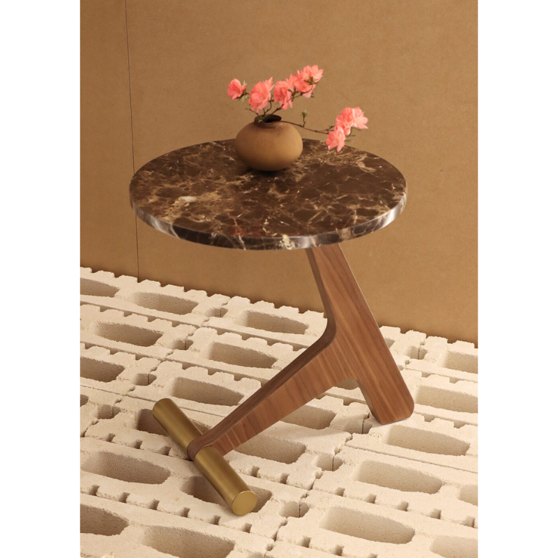 The emperador marble tabletop with walnut base Puntero Side Table from Nomon in a lounge.