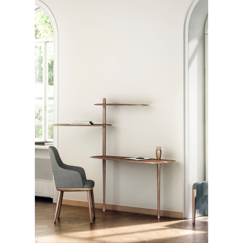 The walnut Unica Escritorio Desk from Nomon in a lounge.