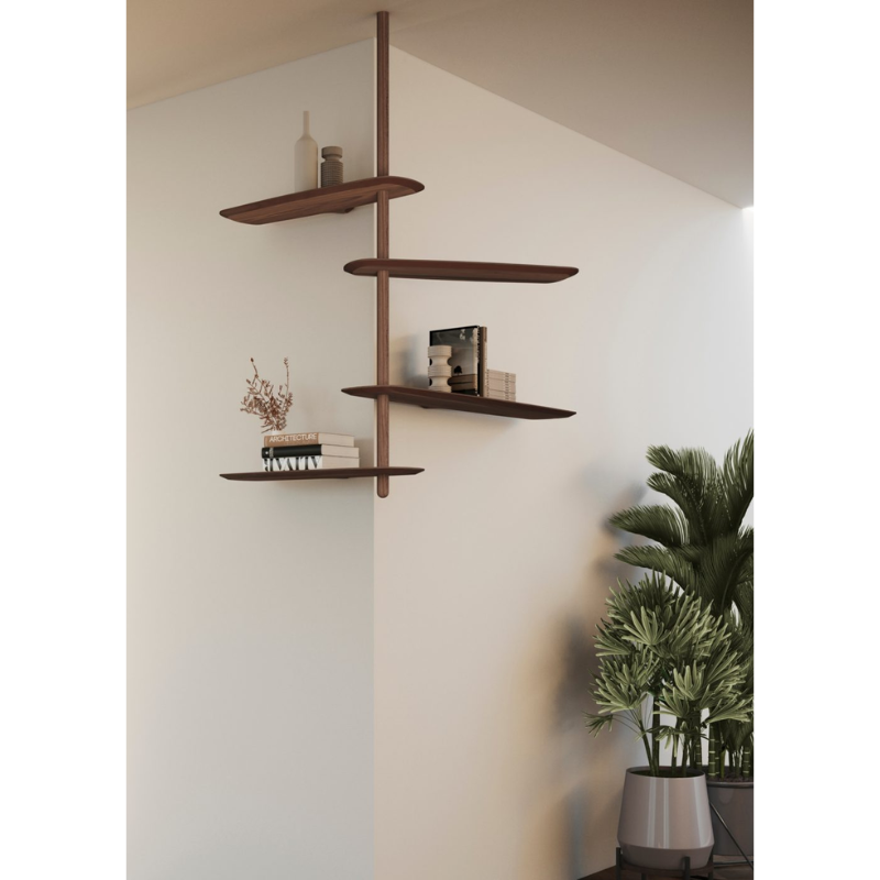 The walnut Unica Shelving Ceiling from Nomon in a corner of a living room.