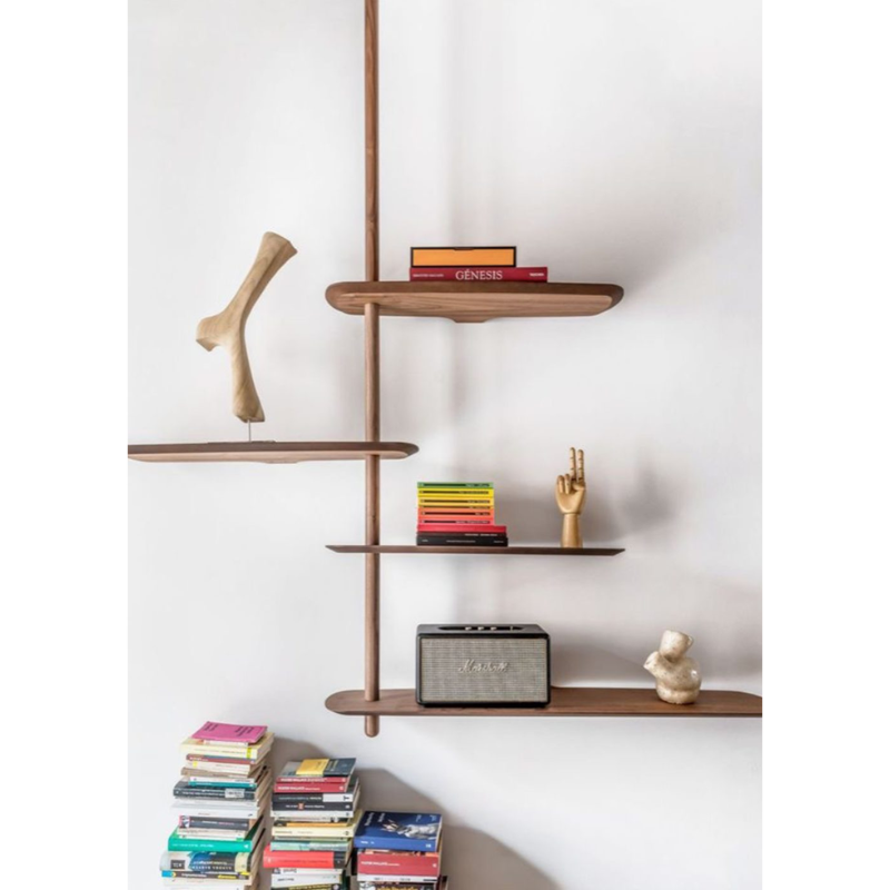 The walnut Unica Shelving Ceiling from Nomon used for decor.