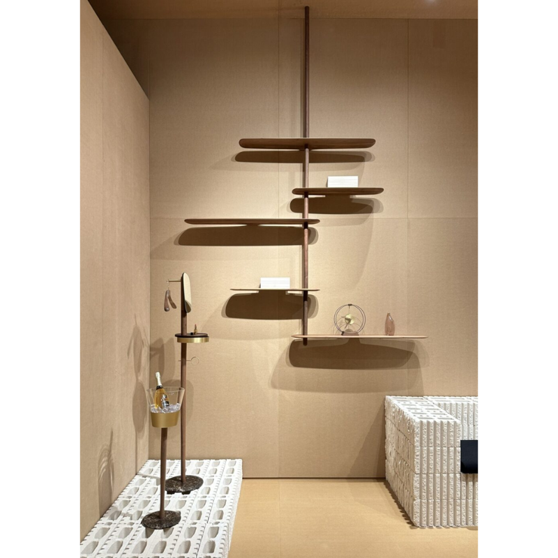 The walnut Unica Shelving Ceiling from Nomon in a designer home.