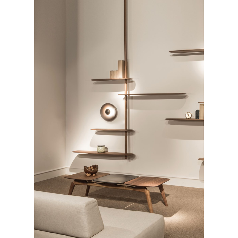 The walnut Unica Shelving Ceiling from Nomon in a living room.