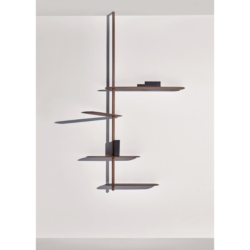 The walnut Unica Shelving Ceiling from Nomon in a studio.