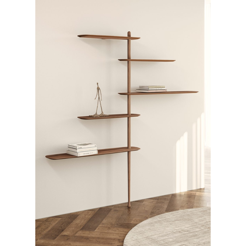 The walnut Unica Shelving Floor from Nomon in a den.