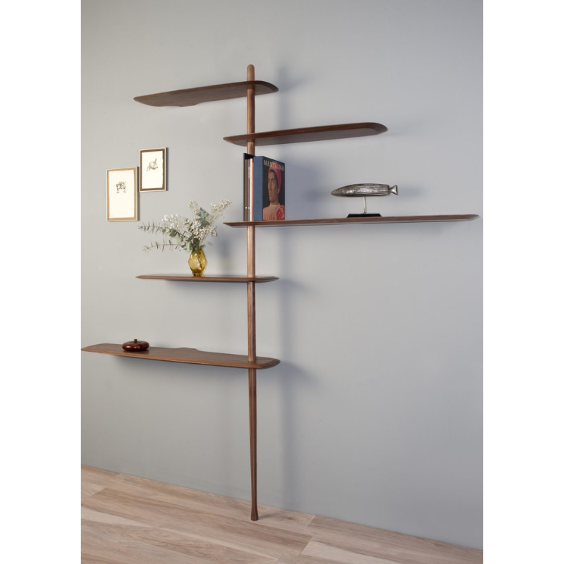 The walnut Unica Shelving Floor from Nomon in a family space.