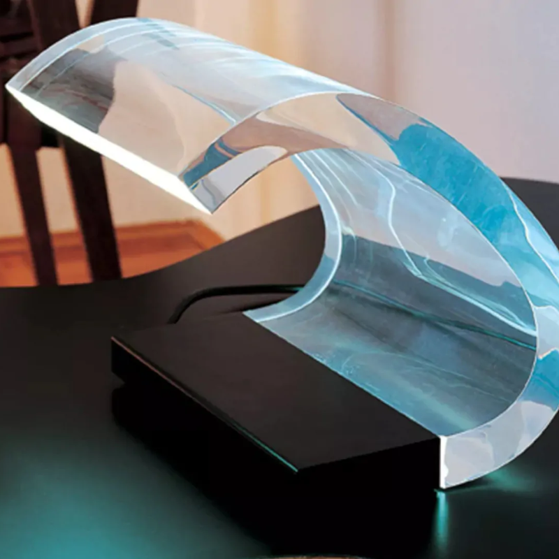 The Acrilica Table Lamp from Oluce in a living room.