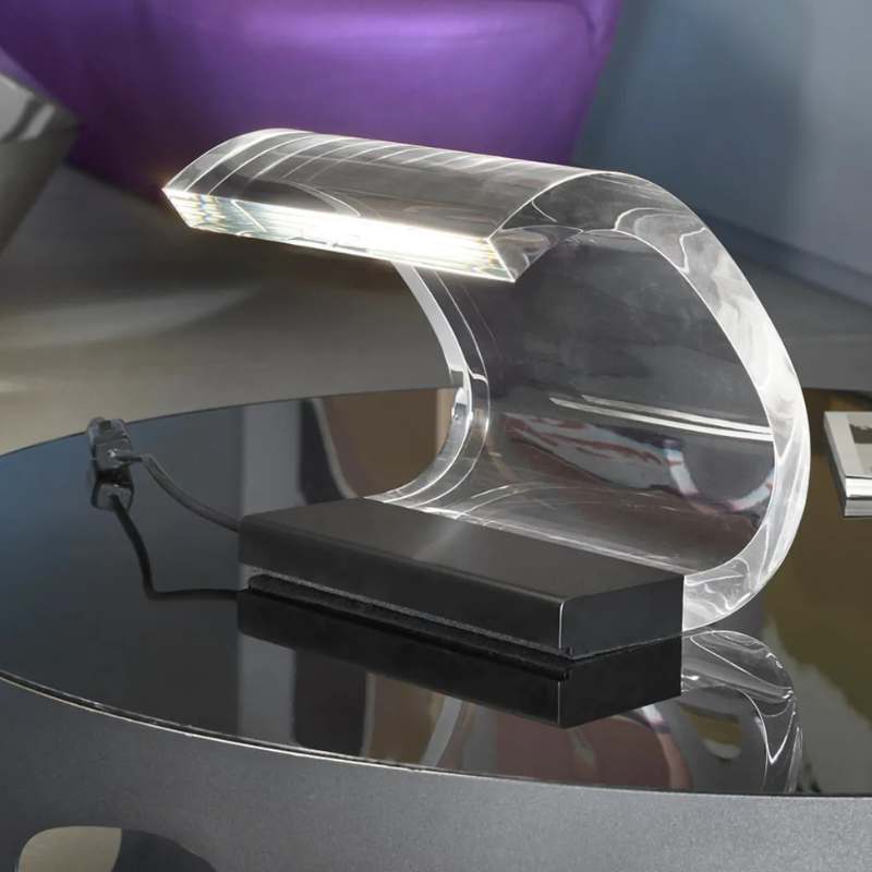 The Acrilica Table Lamp from Oluce in a lounge.