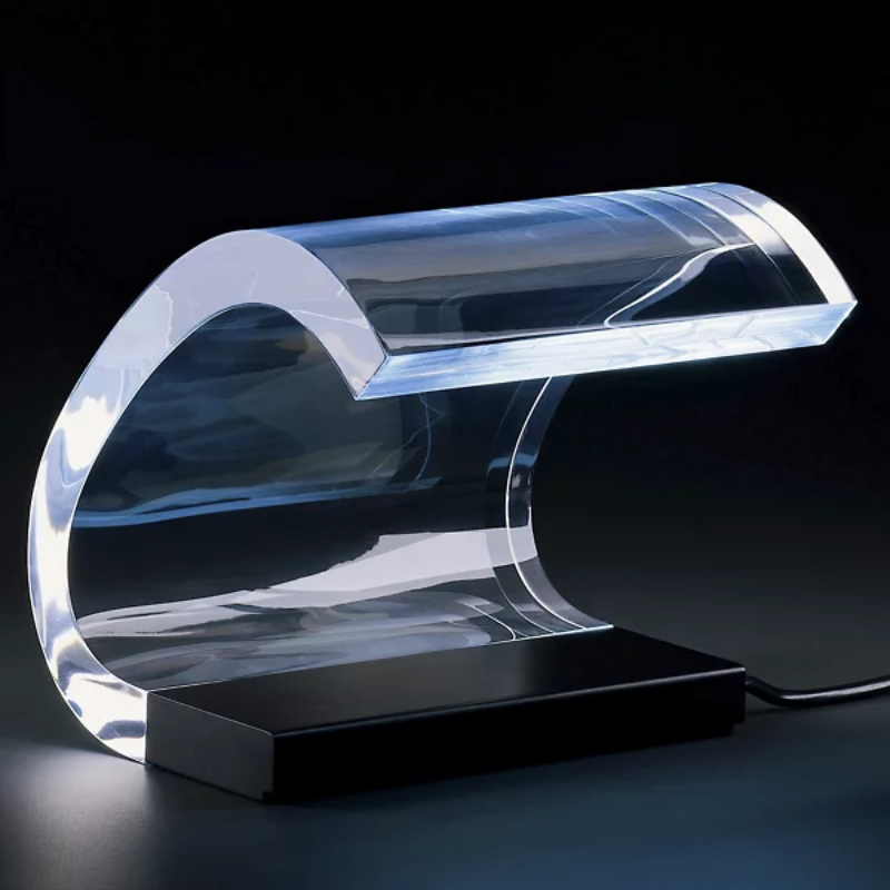 The Acrilica Table Lamp from Oluce in a studio.