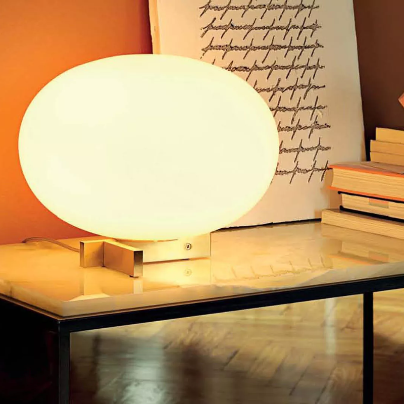 The Alba Table Lamp from Oluce in a living room.