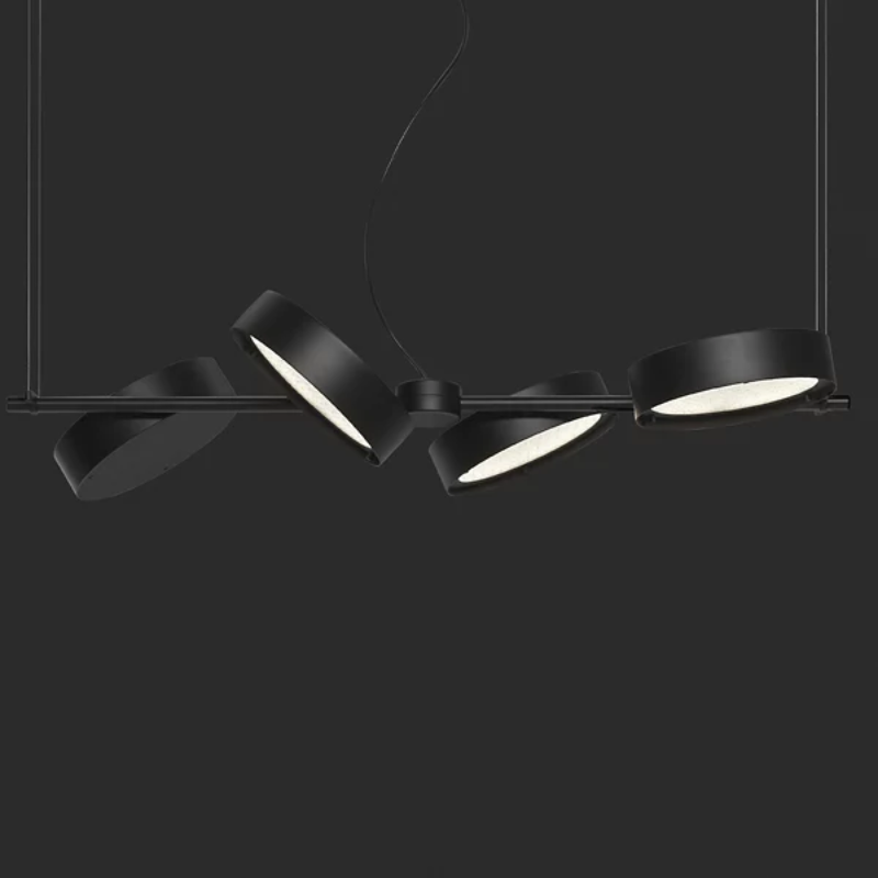 The Berlin Linear Suspension from Oluce in matte black in a studio.