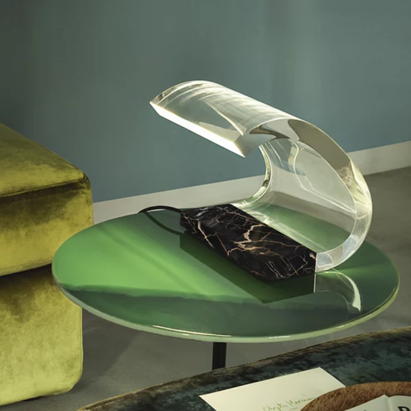 The Marble Acrilica Table Lamp from Oluce in a living room.