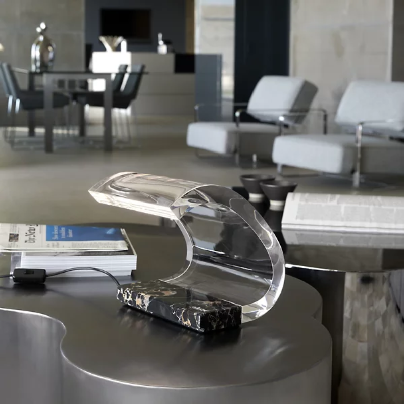 The Marble Acrilica Table Lamp from Oluce in a lounge.