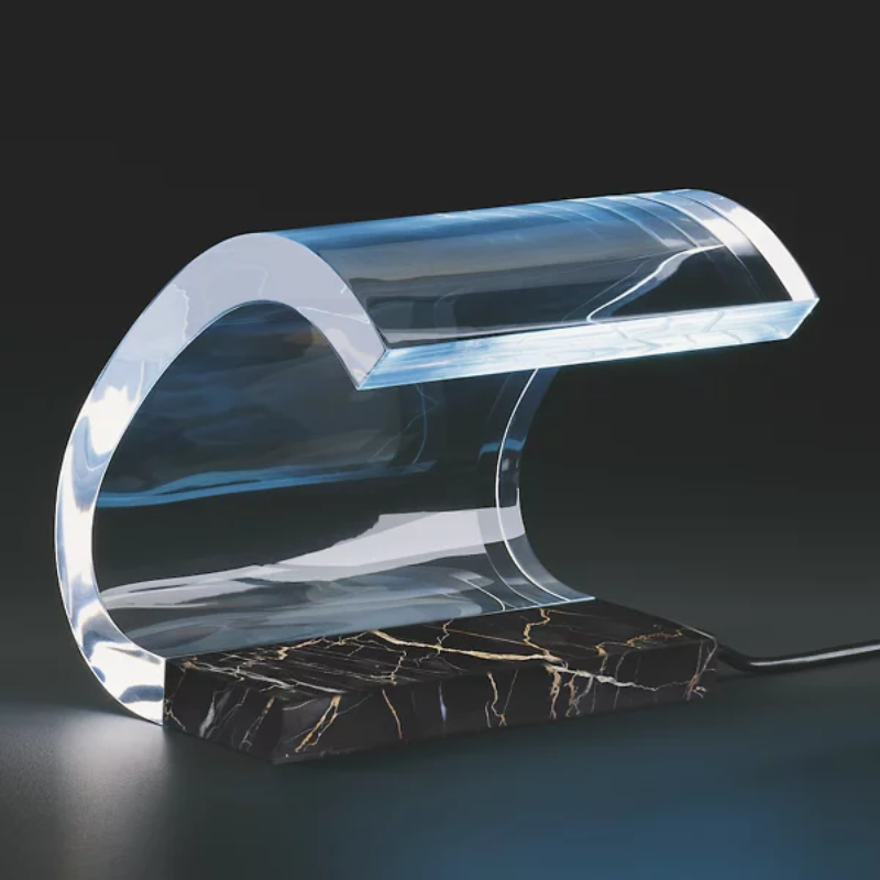 The Marble Acrilica Table Lamp from Oluce in a studio.