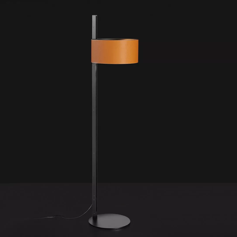 The Parallel Floor Lamp from Oluce in brown leather in a dark room.