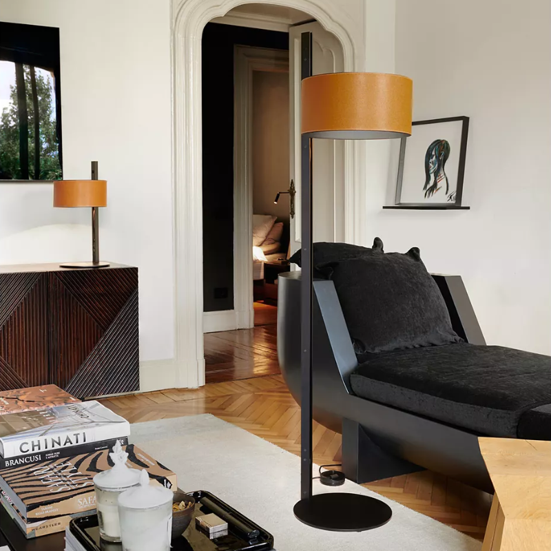 The Parallel Floor Lamp from Oluce in brown leather in a lounge.