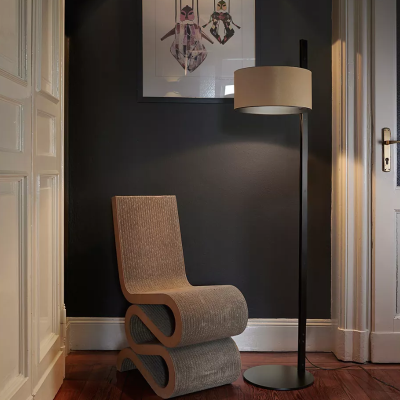 The Parallel Floor Lamp from Oluce in sand leather in a living room.