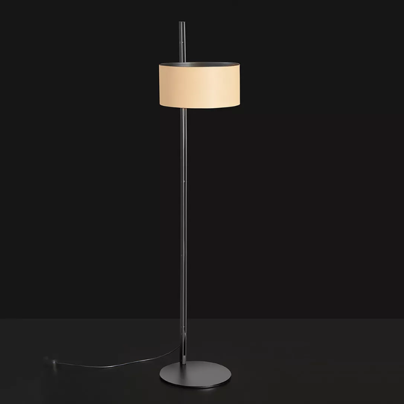 The Parallel Floor Lamp from Oluce in sand leather in a studio.