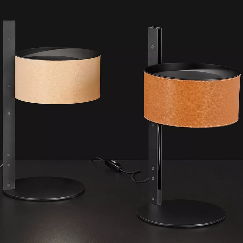 The Parallel Table Lamp from Oluce in brown and sand leather. all-groups