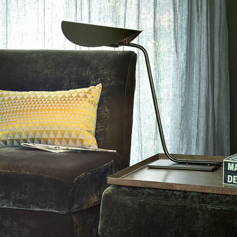 The Plume Table Lamp from Oluce in a living room.