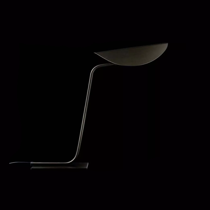 The Plume Table Lamp from Oluce in a studio.